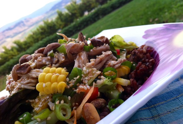 Asian Style Salad with shredded chicken on a bed of cooled red rice