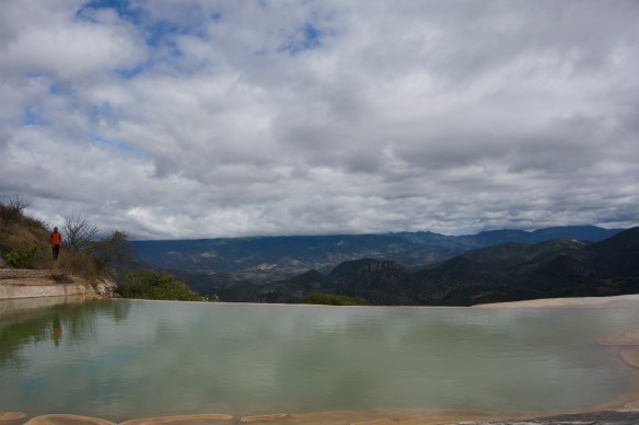 An ancient version of an infinity pool - although you sure would NOT want to go over the edge in this - not sure where you would end up.  The calcified water is so green, and a very rich site against all the mountains.