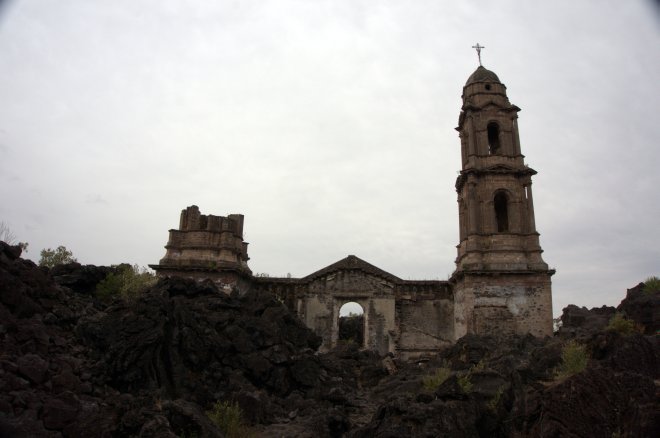 Lava rock all around the church, the lower levels completely submerged but this upper portion remained - with the altar intact inside