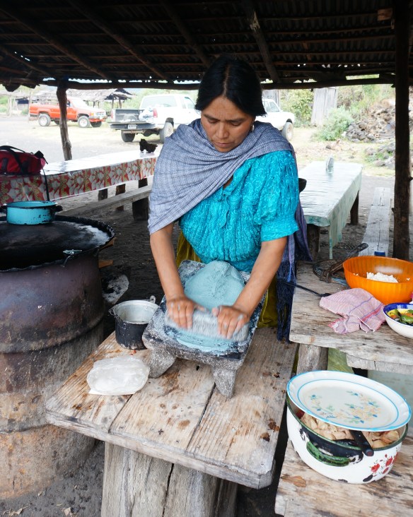 Maria, making us gorditas from blue corn flour - traditional methods and traditional clothing used in this village.