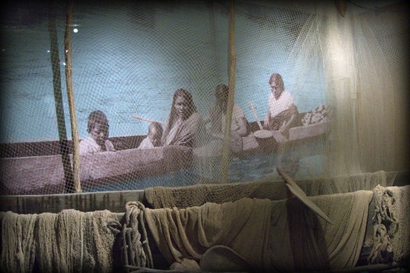 Typical indigenous fishing family in dugout canoe.