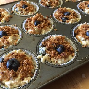 Pecan crumble gently pressed on - muffins are ready for the oven.