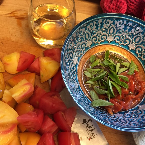 Juicy tomatoes, bursting with flavour, basil out of the garden and naturally, a crisp glass of Pinot Grigio while preparing it all.